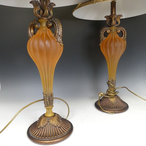 419 - A pair of Antique frosted amber resin and gilt wood table Lamps, H 76 cm.