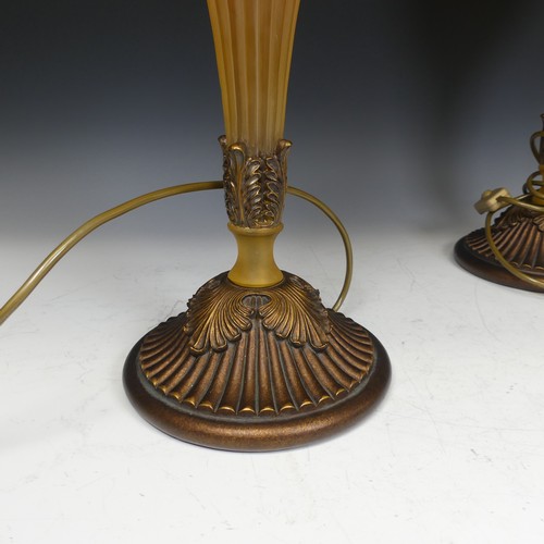 419 - A pair of Antique frosted amber resin and gilt wood table Lamps, H 76 cm.