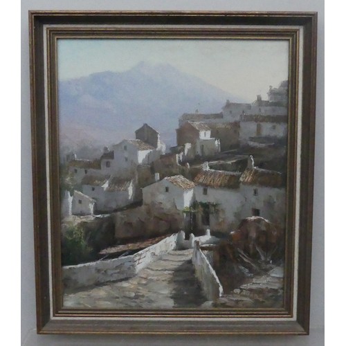 169 - Manuel Cuberos (b. 1933), View of a Spanish village, oil on canvas, signed, 54cm 45cm, framed.... 