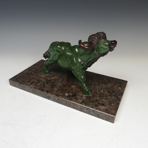 123 - A decorative carved green soapstone Buffalo, mounted on Labrador antique granite base, W:30cm x D:15... 