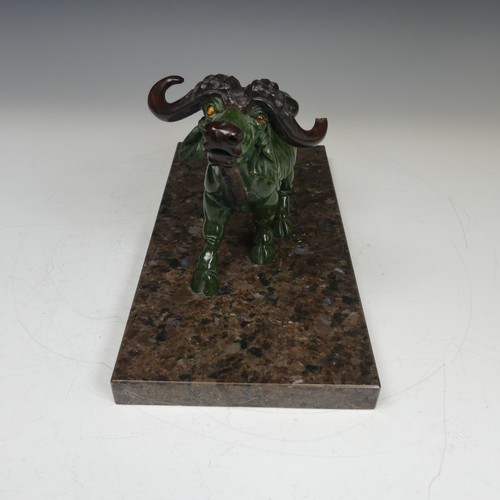 123 - A decorative carved green soapstone Buffalo, mounted on Labrador antique granite base, W:30cm x D:15... 