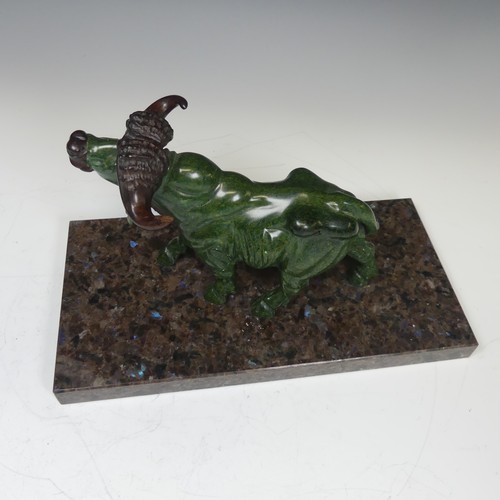 123 - A decorative carved green soapstone Buffalo, mounted on Labrador antique granite base, W:30cm x D:15... 