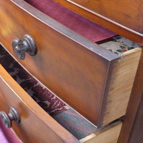 426 - A Victorian mahogany bow-front Chest of drawers, with shaped apron and feet, W 124 cm x H 103.5 cm x... 