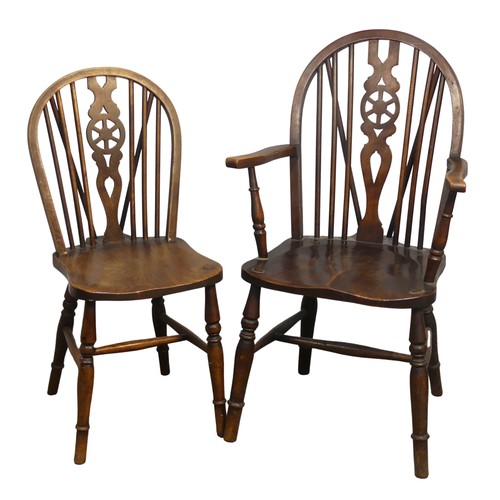 427 - An Antique Windsor Armchair, with pierced wheel splat back over shaped seat, raised on turned legs u... 