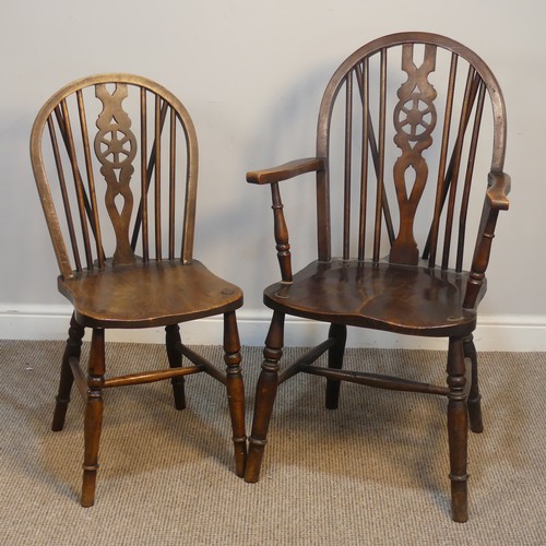 427 - An Antique Windsor Armchair, with pierced wheel splat back over shaped seat, raised on turned legs u... 