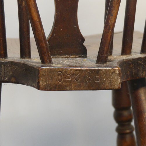 427 - An Antique Windsor Armchair, with pierced wheel splat back over shaped seat, raised on turned legs u... 