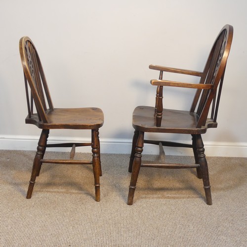 427 - An Antique Windsor Armchair, with pierced wheel splat back over shaped seat, raised on turned legs u... 