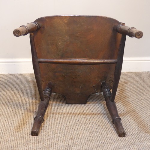 427 - An Antique Windsor Armchair, with pierced wheel splat back over shaped seat, raised on turned legs u... 