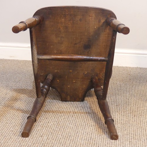 427 - An Antique Windsor Armchair, with pierced wheel splat back over shaped seat, raised on turned legs u... 