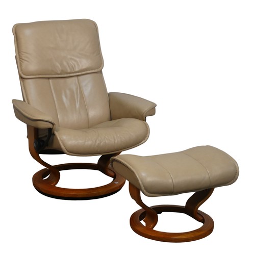 428 - An Ekornes 'Stressless' cream leather Armchair, W 77 cm x H 103 cm x D 70 cm, together with a matchi... 