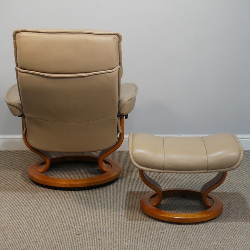 428 - An Ekornes 'Stressless' cream leather Armchair, W 77 cm x H 103 cm x D 70 cm, together with a matchi... 