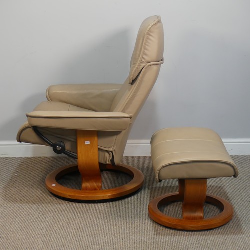 428 - An Ekornes 'Stressless' cream leather Armchair, W 77 cm x H 103 cm x D 70 cm, together with a matchi... 