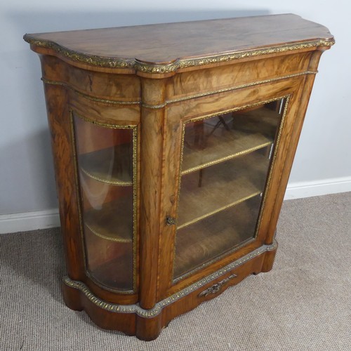 444 - A Victorian gilt metal mounted walnut Credenza, central glass door with gilt metal surround, flanked... 