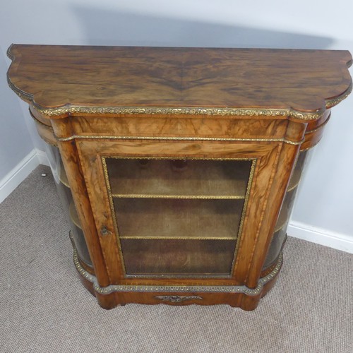 444 - A Victorian gilt metal mounted walnut Credenza, central glass door with gilt metal surround, flanked... 