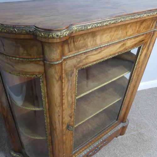 444 - A Victorian gilt metal mounted walnut Credenza, central glass door with gilt metal surround, flanked... 