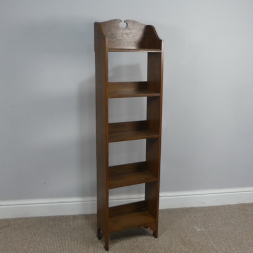 447 - An Arts and Crafts thin oak open Bookcase, W 30.5 cm x H 117 cm x D 15.5 cm.