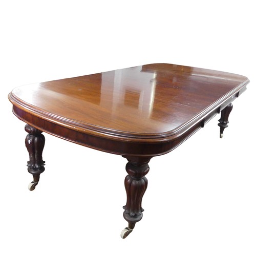 457 - A Victorian mahogany extending Dining Table, raised on bulbous carved legs upon ceramic castors, W 2... 