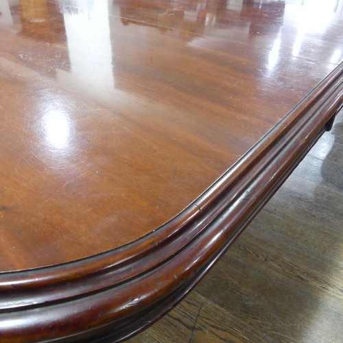 457 - A Victorian mahogany extending Dining Table, raised on bulbous carved legs upon ceramic castors, W 2... 