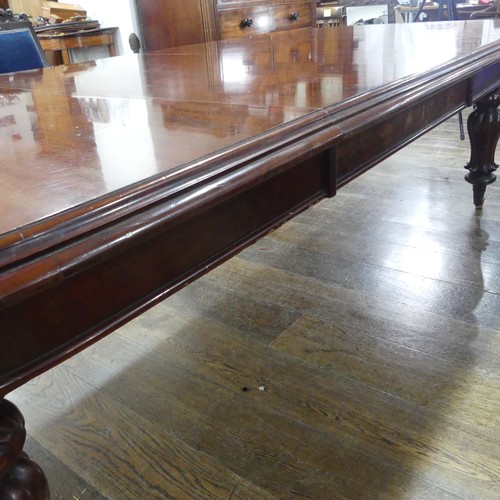 457 - A Victorian mahogany extending Dining Table, raised on bulbous carved legs upon ceramic castors, W 2... 