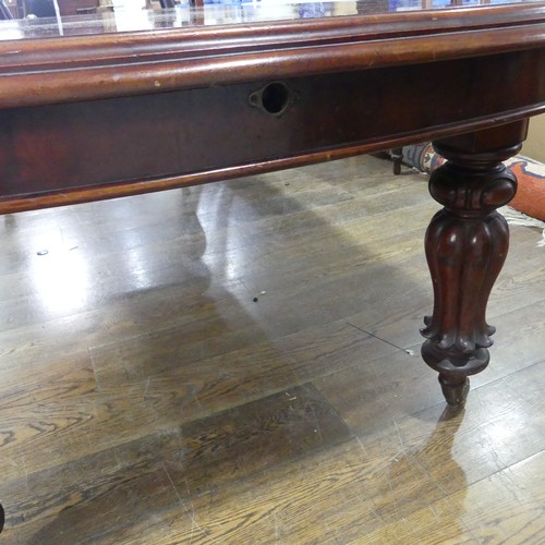 457 - A Victorian mahogany extending Dining Table, raised on bulbous carved legs upon ceramic castors, W 2... 