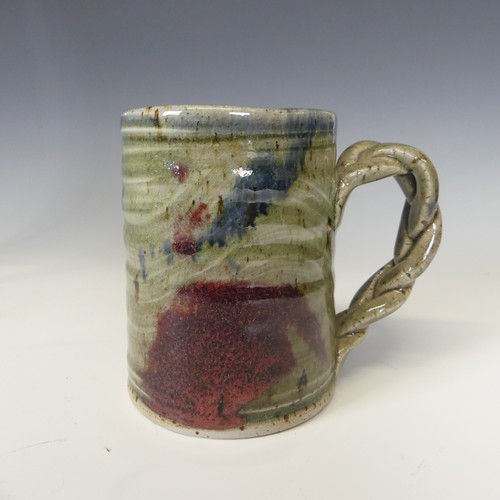 55 - A large collection of Studio Pottery Mugs, comprising Keith Smith examples, Dartington Pottery, etc.... 