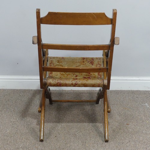 464 - An early 20th century mahogany folding campaign Chair, with tapestry seat, W 49cm x H 80cm x D 73cm... 