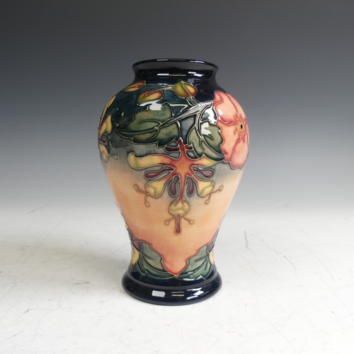 61 - A Moorcroft pottery 'Oberon' pattern Vase, of baluster form, typical tube lined decoration, factory ... 