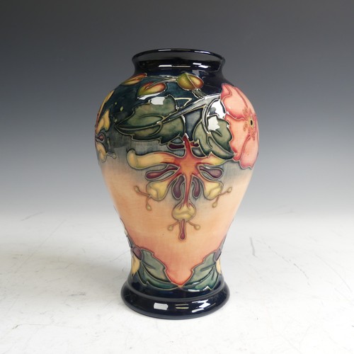 61 - A Moorcroft pottery 'Oberon' pattern Vase, of baluster form, typical tube lined decoration, factory ... 