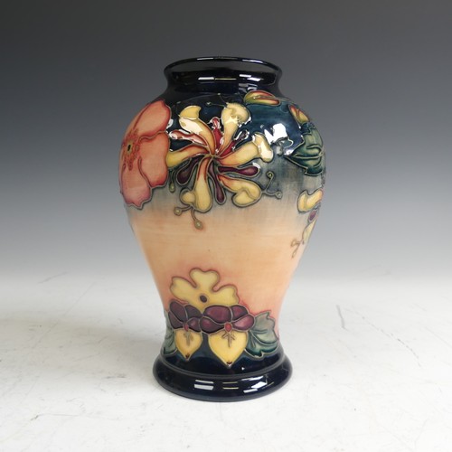 61 - A Moorcroft pottery 'Oberon' pattern Vase, of baluster form, typical tube lined decoration, factory ... 