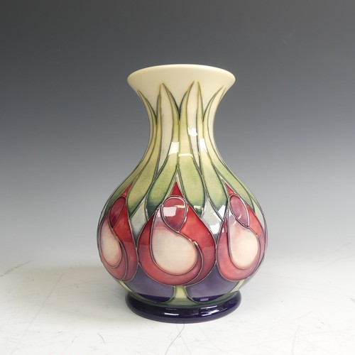 62 - A Moorcroft pottery 'April Tulips' pattern Vase, decorated with stylised flowers, factory marks to b... 