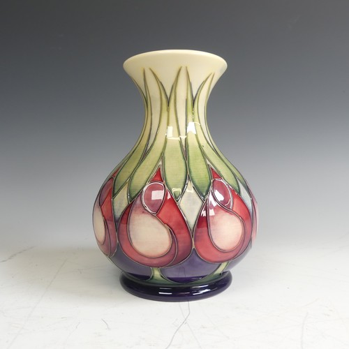 62 - A Moorcroft pottery 'April Tulips' pattern Vase, decorated with stylised flowers, factory marks to b... 