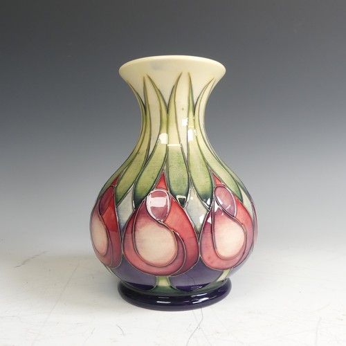 62 - A Moorcroft pottery 'April Tulips' pattern Vase, decorated with stylised flowers, factory marks to b... 