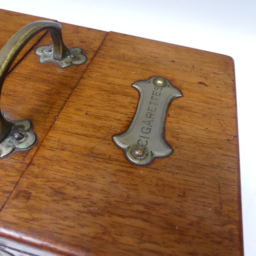 472 - An Early 20th century Arts and Crafts oak metal bound smokers Box, with central carry handle and twi... 