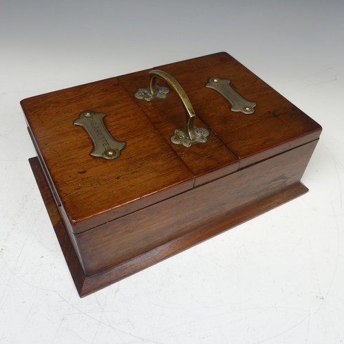 472 - An Early 20th century Arts and Crafts oak metal bound smokers Box, with central carry handle and twi... 