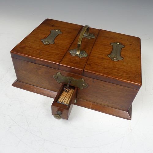 472 - An Early 20th century Arts and Crafts oak metal bound smokers Box, with central carry handle and twi... 