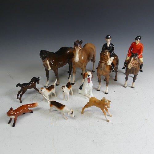 69 - A Beswick pottery Hunt, comprising a red coat rider, a black coat rider, two foals, three hounds, a ... 