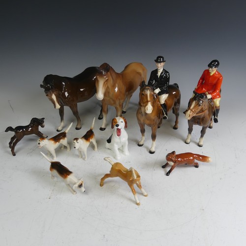 69 - A Beswick pottery Hunt, comprising a red coat rider, a black coat rider, two foals, three hounds, a ... 