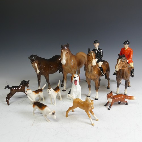 69 - A Beswick pottery Hunt, comprising a red coat rider, a black coat rider, two foals, three hounds, a ... 