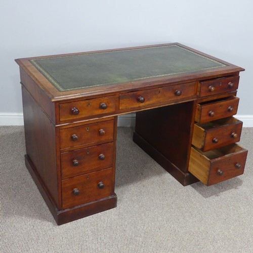 476 - A Victorian mahogany pedestal Desk, with green skived leatherette top, knee hole flanked by three dr... 