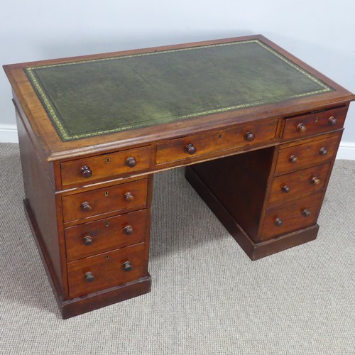 476 - A Victorian mahogany pedestal Desk, with green skived leatherette top, knee hole flanked by three dr... 