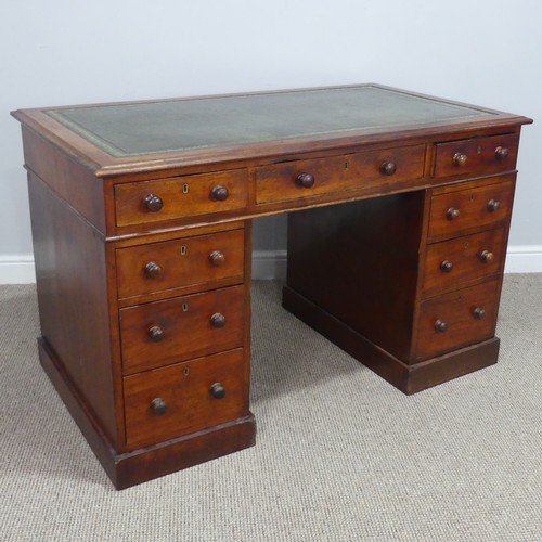 476 - A Victorian mahogany pedestal Desk, with green skived leatherette top, knee hole flanked by three dr... 