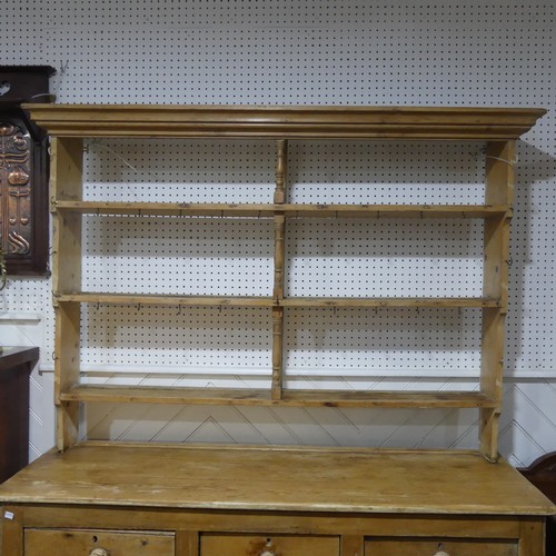 479 - An Antique Pine Kitchen Dresser, moulded cornice over three shelves with hooks, upon base with plint... 