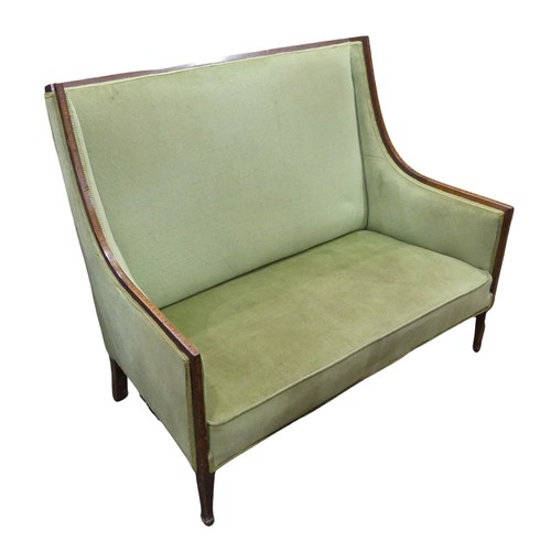 485 - An Edwardian mahogany Show Frame upholstered Two Seat Sofa, with strip inlay, raised on spaded feet,... 