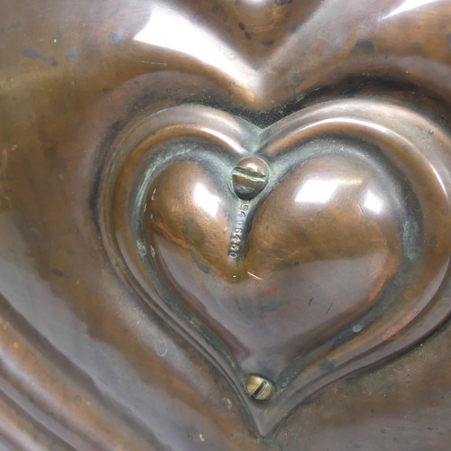 493 - An Art Nouveau hammered copper heart shaped Coal Box, front marked with 'Rd 406450', W 40 cm x H 50 ... 