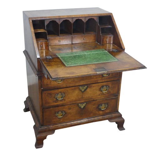 509 - A small Georgian flame mahogany Bureau, sloped fall front enclosing gilt tooled writing skiver and f... 