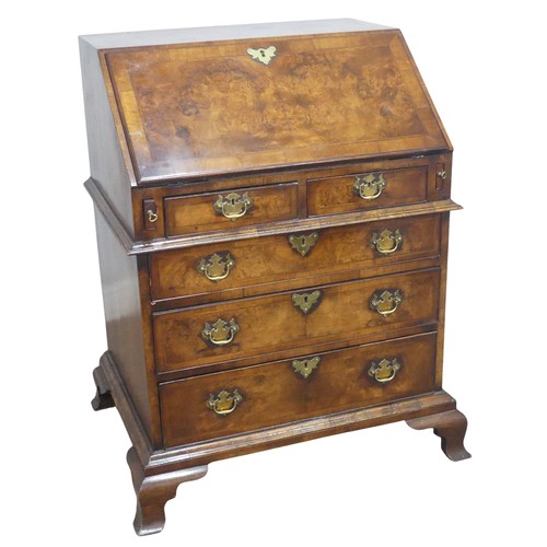 509 - A small Georgian flame mahogany Bureau, sloped fall front enclosing gilt tooled writing skiver and f... 