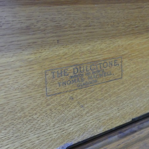 510 - An early 20th century oak cased 'Dulcitone' portable Piano, made by 'Thomas Machell, Glasgow', stamp... 