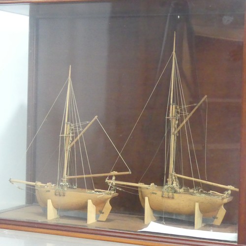 511 - A pair of 19th century model Ships in display case, by Martin Brydon, a sailor who was held prisoner... 