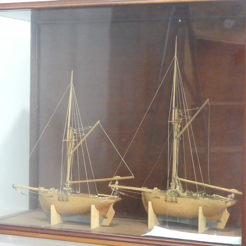 511 - A pair of 19th century model Ships in display case, by Martin Brydon, a sailor who was held prisoner... 