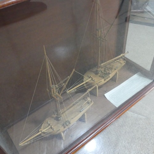 511 - A pair of 19th century model Ships in display case, by Martin Brydon, a sailor who was held prisoner... 